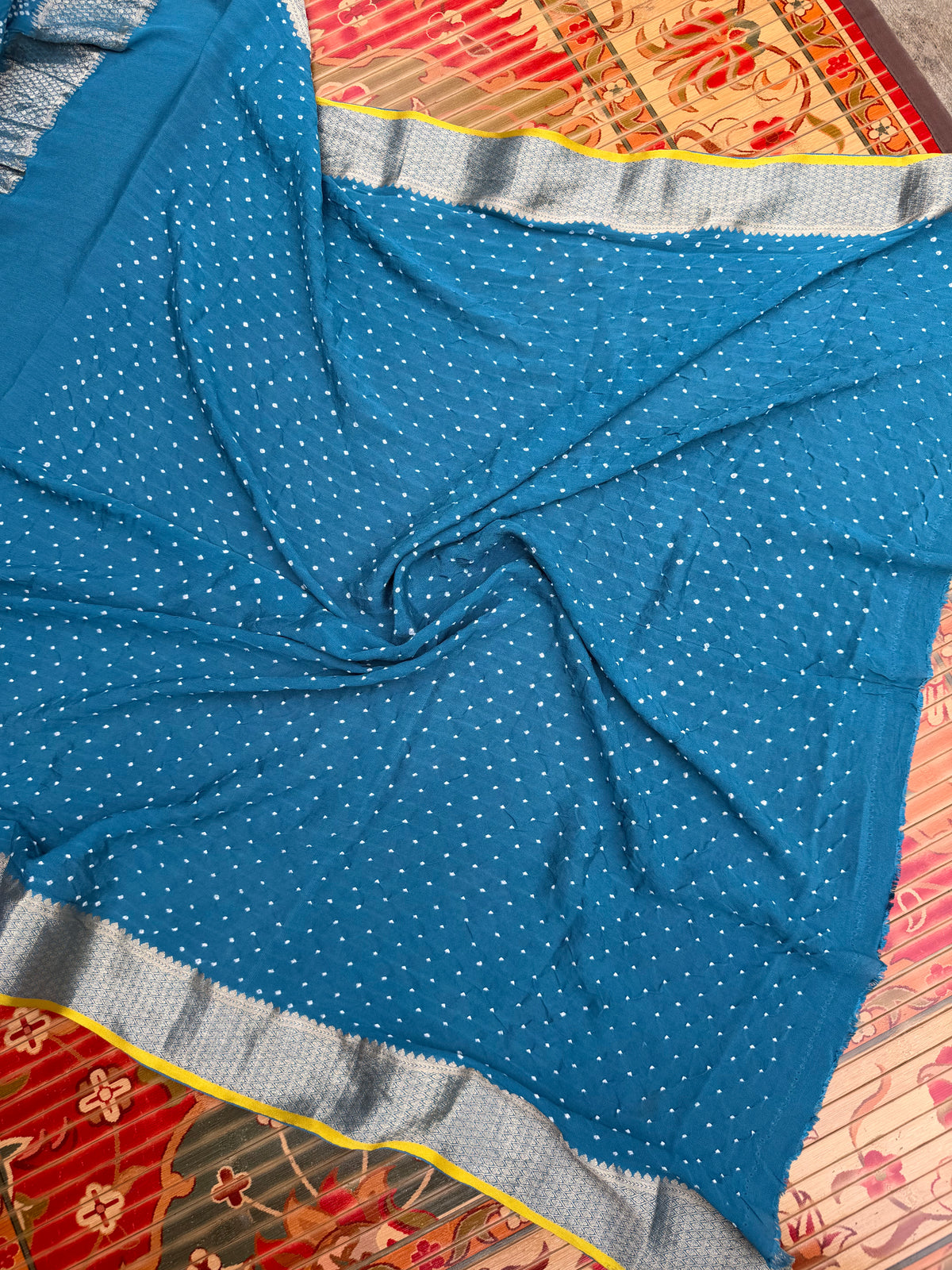 Pure benaras crepe with handknotted bandhini pallus & blouses.