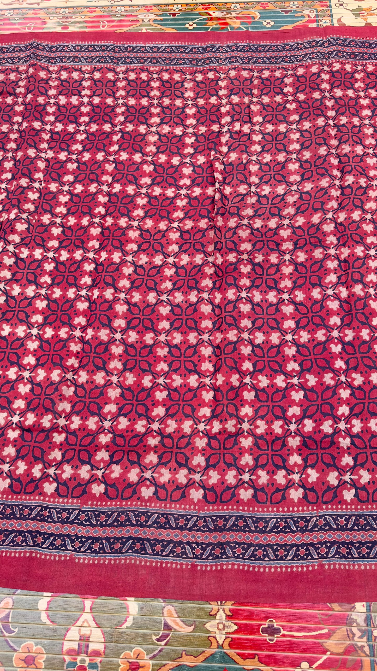 Hand block printed Ajrakh on chiniya silk