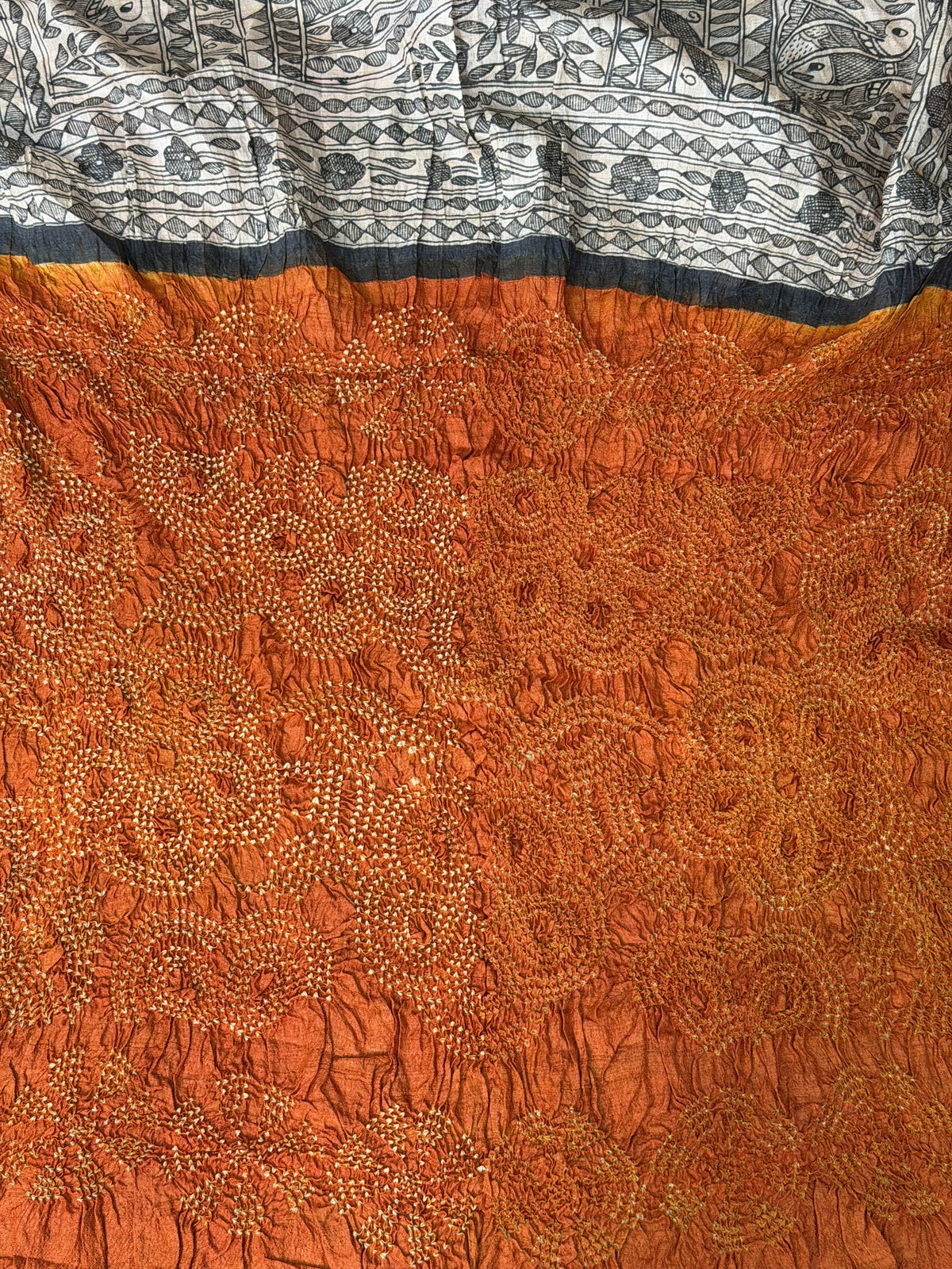 Tussar hand-drawn Madhubani and a handknotted Rai Bandhej saree.