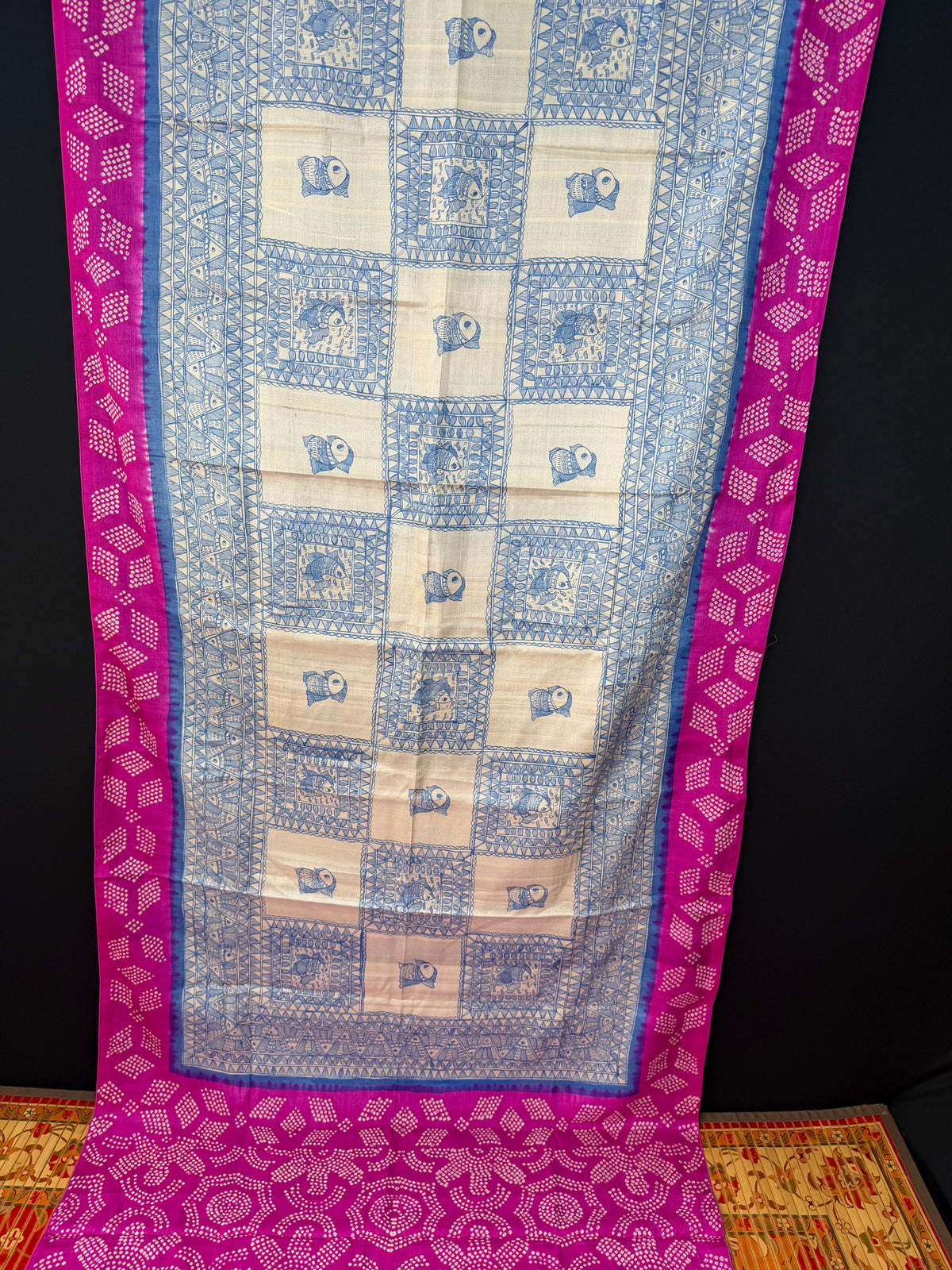 Tussar hand-drawn Madhubani and a handknotted Rai Bandhej saree
