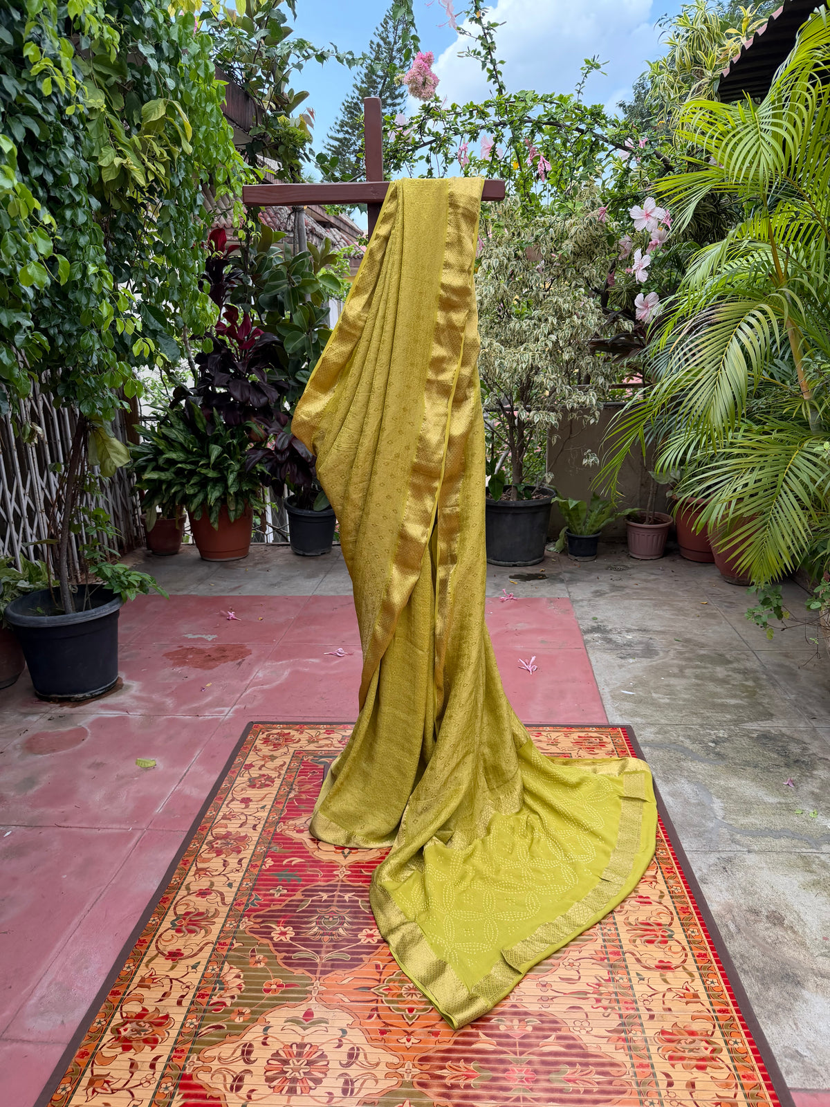 Pure benaras crepe with handknotted bandhini pallus & blouses.