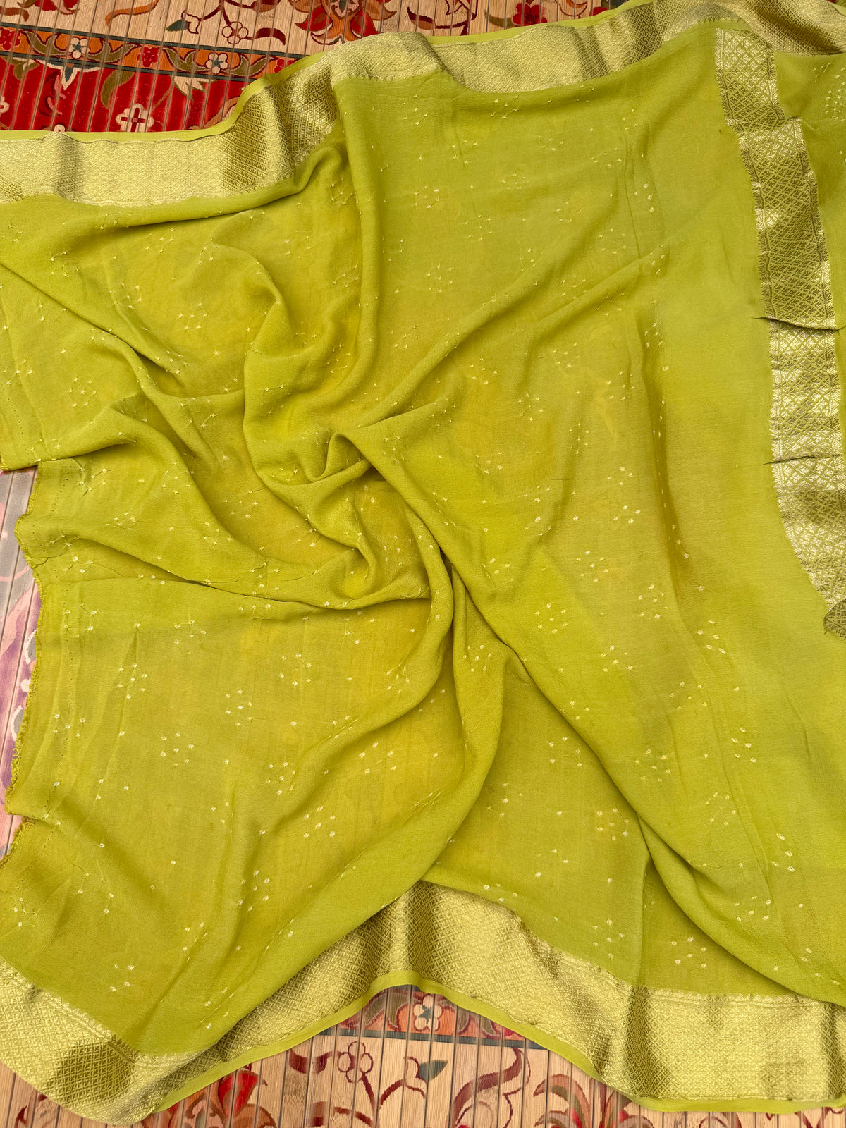Pure benaras crepe with handknotted bandhini pallus & blouses.