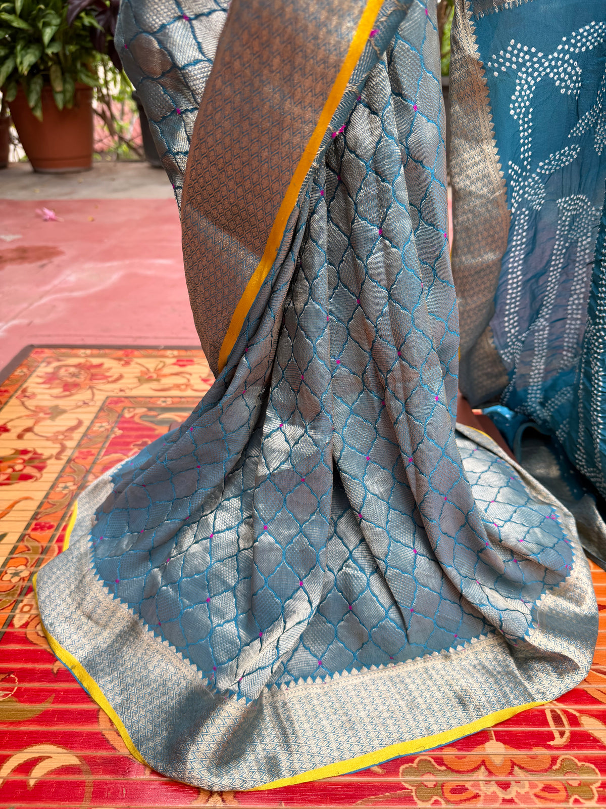 Pure benaras crepe with handknotted bandhini pallus & blouses.
