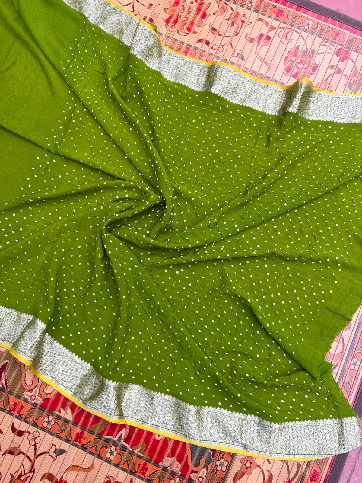 Pure benaras crepe with handknotted bandhini pallus & blouses.