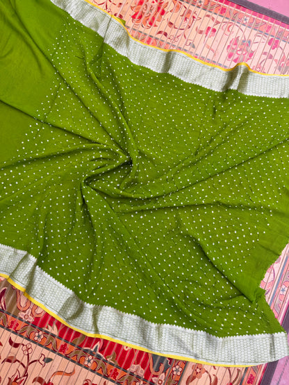 Pure benaras crepe with handknotted bandhini pallus & blouses.