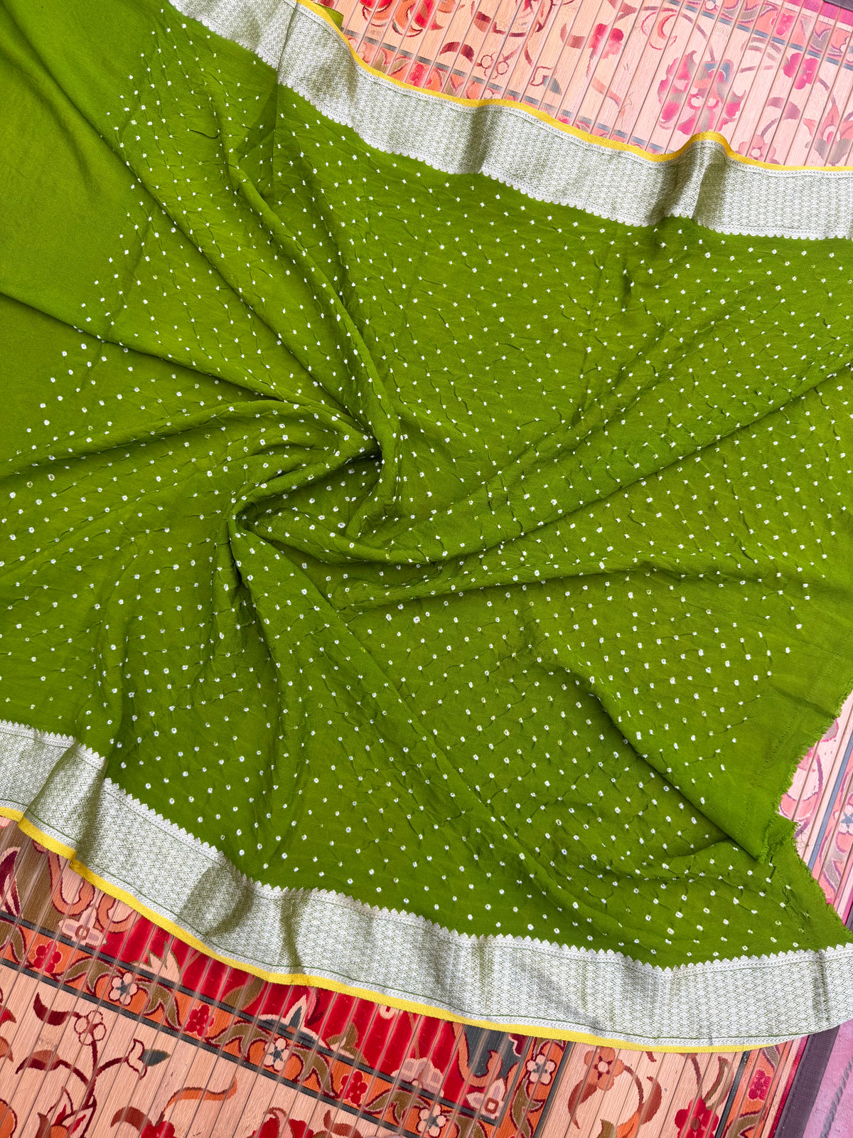 Pure benaras crepe with handknotted bandhini pallus & blouses.